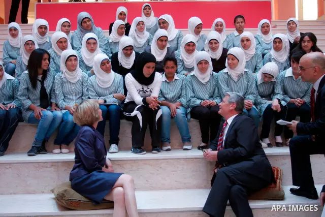 German President Joachim Gauck and Daniela Schadt, German journalist and partner of German President meet schoolgirls during the inauguration of a new girls school in the West Bank village of Burin, Thursday, May 31, 201...