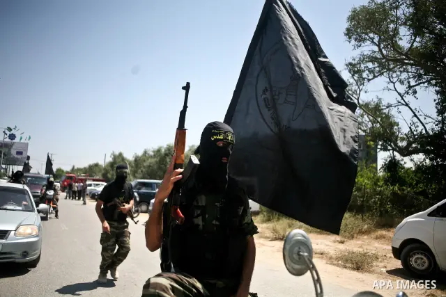 Palestinian Islamic Jihad militants attend the funeral of 12 Palestinian militants transferred from Israel, in Gaza City, Thursday, May 31, 2012. Israel transferred the bodies in an effort to induce Palestinian President...