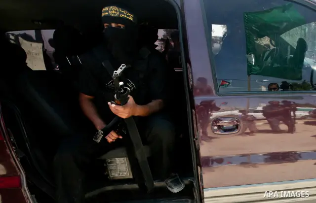 Palestinian Islamic Jihad militants attend the funeral of 12 Palestinian militants transferred from Israel, in Gaza City, Thursday, May 31, 2012. Israel transferred the bodies in an effort to induce Palestinian President...