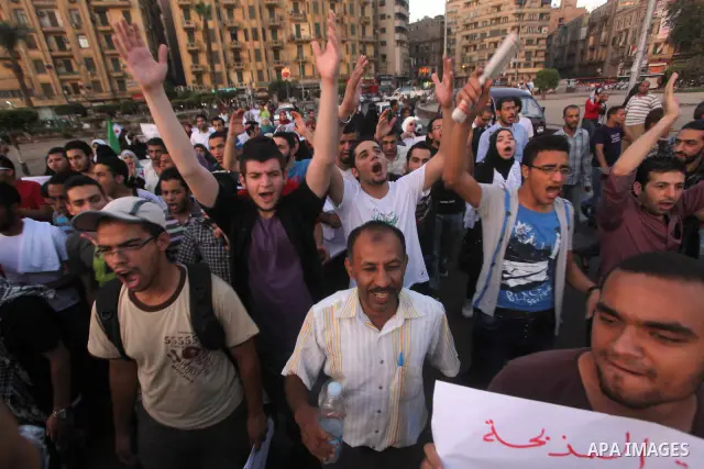 Syrians living in Egypt shout slogans as they protest against the weekend massacre of Houla, in front of the Syrian embassy in Cairo, Egypt, 31 May 2012. A massacre was reported in the central Syrian city of Houla over t...