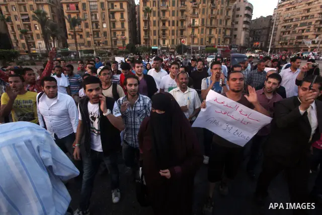 Syrians living in Egypt shout slogans as they protest against the weekend massacre of Houla, in front of the Syrian embassy in Cairo, Egypt, 31 May 2012. A massacre was reported in the central Syrian city of Houla over t...