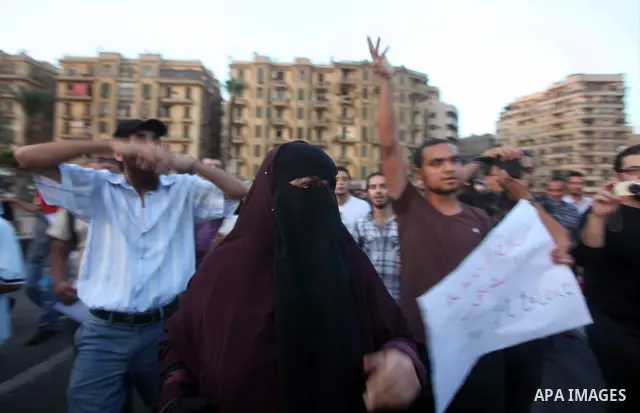 Syrians living in Egypt shout slogans as they protest against the weekend massacre of Houla, in front of the Syrian embassy in Cairo, Egypt, 31 May 2012. A massacre was reported in the central Syrian city of Houla over t...