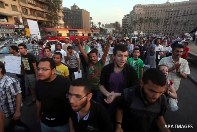 Syrians living in Egypt shout slogans as they protest against the weekend massacre of Houla, in front of the Syrian embassy in Cairo, Egypt, 31 May 2012. A massacre was reported in the central Syrian city of Houla over t...