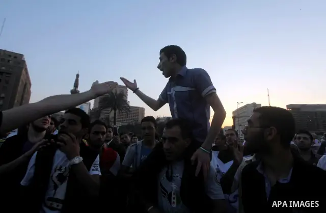 Syrians living in Egypt shout slogans as they protest against the weekend massacre of Houla, in front of the Syrian embassy in Cairo, Egypt, 31 May 2012. A massacre was reported in the central Syrian city of Houla over t...
