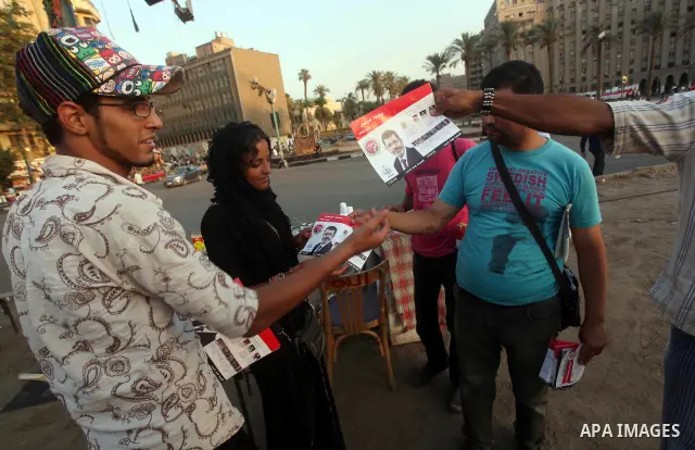 Egyptian Protester holds picture of candidate Mohammed Morsi during a protest against candidate Ahmed Shafiq, at Tahrir Square in Cairo May 31, 2012. The prospect of Shafiq succeeding Hosni Mubarak as president of Egypt...