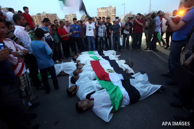 Protesters show solidarity with victims of massacre of Houla during a protest in front of the Syrian embassy in Cairo, Egypt, 31 May 2012. A massacre was reported in the central Syrian city of Houla over the weekend, how...