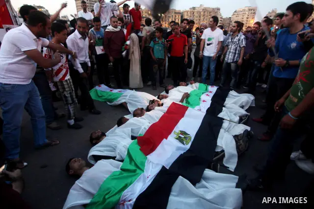 Protesters show solidarity with victims of massacre of Houla during a protest in front of the Syrian embassy in Cairo, Egypt, 31 May 2012. A massacre was reported in the central Syrian city of Houla over the weekend, how...