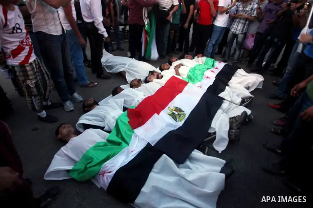 Protesters show solidarity with victims of massacre of Houla during a protest in front of the Syrian embassy in Cairo, Egypt, 31 May 2012. A massacre was reported in the central Syrian city of Houla over the weekend, how...