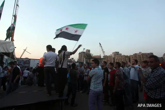 Protesters shout slogans as they protest against the weekend massacre of Houla, in front of the Syrian embassy in Cairo, Egypt, 31 May 2012. A massacre was reported in the central Syrian city of Houla over the weekend, h...