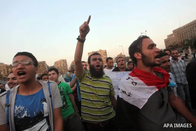 Protesters shout slogans as they protest against the weekend massacre of Houla, in front of the Syrian embassy in Cairo, Egypt, 31 May 2012. A massacre was reported in the central Syrian city of Houla over the weekend, h...