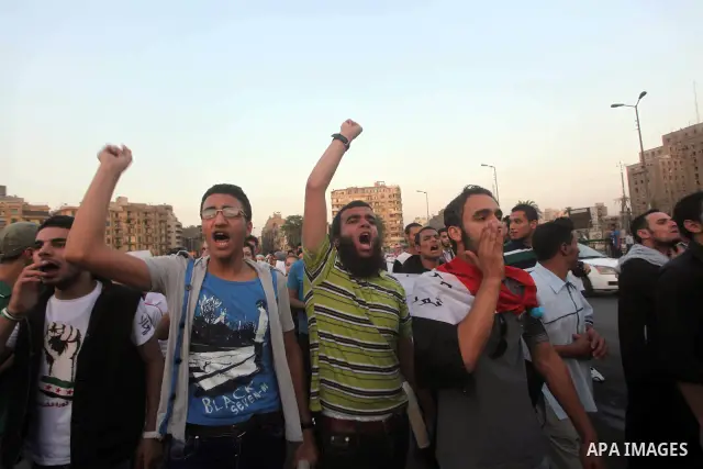 Protesters shout slogans as they protest against the weekend massacre of Houla, in front of the Syrian embassy in Cairo, Egypt, 31 May 2012. A massacre was reported in the central Syrian city of Houla over the weekend, h...