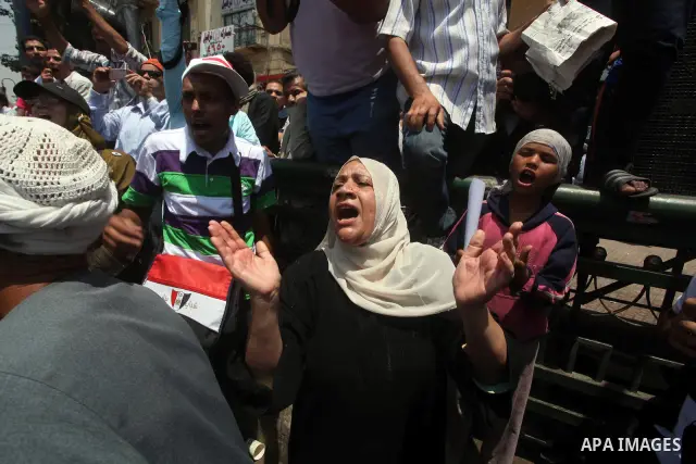 Egyptian protesters hold placards and shout slogans against the presidential candidate Ahmed Shafik, during a protest in Tahrir Square, Cairo, Egypt, 01 June 2012. Media reports state that hundreds of Egyptians held a de...