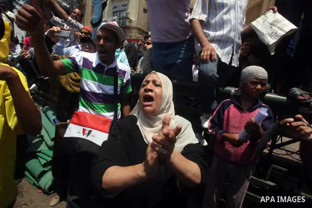 Egyptian protesters hold placards and shout slogans against the presidential candidate Ahmed Shafik, during a protest in Tahrir Square, Cairo, Egypt, 01 June 2012. Media reports state that hundreds of Egyptians held a de...