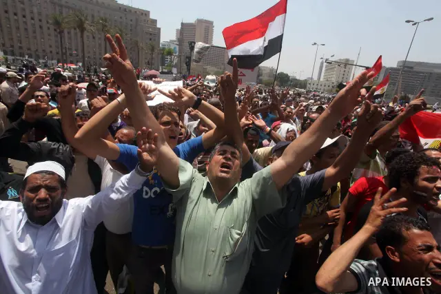 Egyptian protesters hold placards and shout slogans against the presidential candidate Ahmed Shafik, during a protest in Tahrir Square, Cairo, Egypt, 01 June 2012. Media reports state that hundreds of Egyptians held a de...