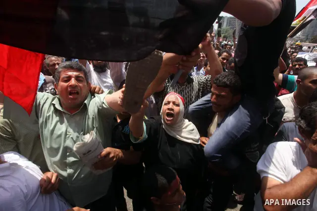 Egyptian protesters hold placards and shout slogans against the presidential candidate Ahmed Shafik, during a protest in Tahrir Square, Cairo, Egypt, 01 June 2012. Media reports state that hundreds of Egyptians held a de...