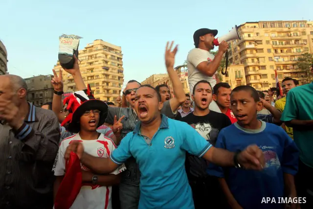 Egyptian protesters chant slogans against Egyptian presidential candidate Ahmed Shafiq in Tahrir Square decrying the result of the first round of voting in the Egyptian presidential election in Cairo, Egypt, Friday, June...