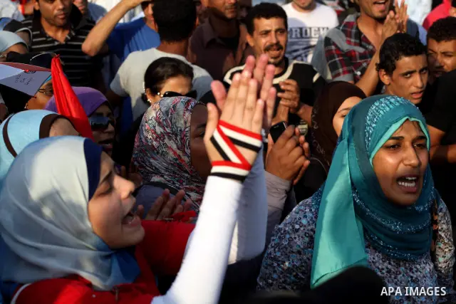 Egyptian protesters chant slogans against Egyptian presidential candidate Ahmed Shafiq in Tahrir Square decrying the result of the first round of voting in the Egyptian presidential election in Cairo, Egypt, Friday, June...