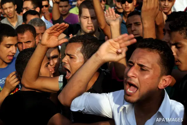 Egyptian protesters chant slogans against Egyptian presidential candidate Ahmed Shafiq in Tahrir Square decrying the result of the first round of voting in the Egyptian presidential election in Cairo, Egypt, Friday, June...