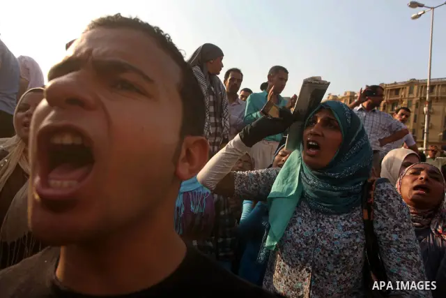 Egyptian protesters chant slogans against Egyptian presidential candidate Ahmed Shafiq in Tahrir Square decrying the result of the first round of voting in the Egyptian presidential election in Cairo, Egypt, Friday, June...