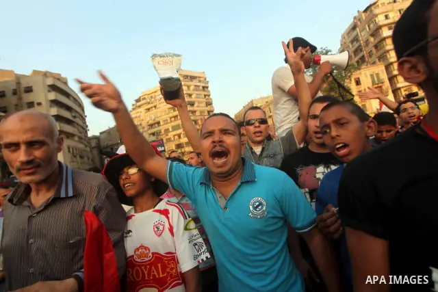 Egyptian protesters chant slogans against Egyptian presidential candidate Ahmed Shafiq in Tahrir Square decrying the result of the first round of voting in the Egyptian presidential election in Cairo, Egypt, Friday, June...