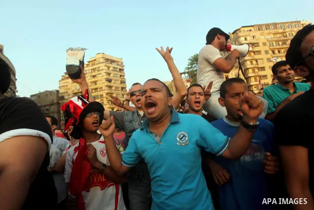 Egyptian protesters chant slogans against Egyptian presidential candidate Ahmed Shafiq in Tahrir Square decrying the result of the first round of voting in the Egyptian presidential election in Cairo, Egypt, Friday, June...