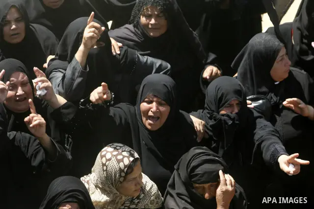 Relatives of Palestinian gunman Ahmed Nassir mourn during his funeral in Khan Younis in the southern Gaza Strip June 2, 2012. A Palestinian gunman, Ahmed Nassir, broke into Israel on Friday and killed a soldier before be...