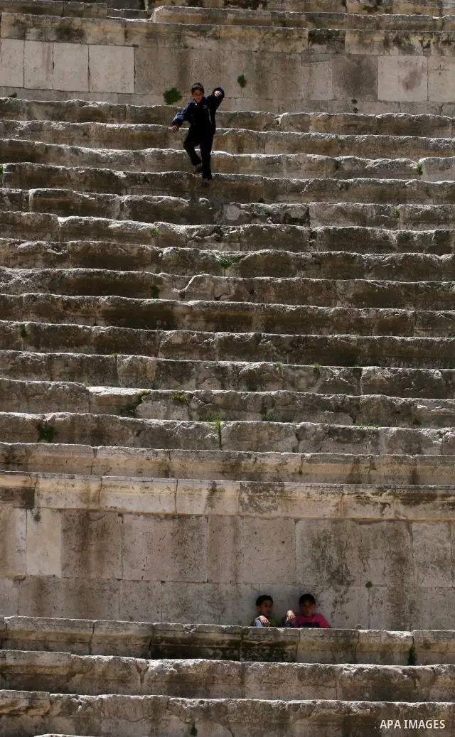 Foreign tourists in the Roman amphitheatre in Amman, Jordan, June 2, 2012. Amphitheatre of the most important Roman monuments in Amman, was built 161 years AD. Photo by Issam Rimawi