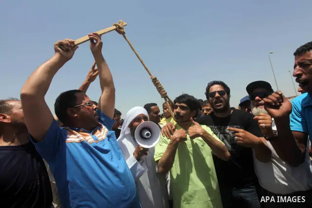 Relatives of people who died during Egypt's revolution react after a court sentenced deposed president Hosni Mubarak to life in prison, outside the police academy where the court is located in Cairo June 2, 2012. Mubarak...