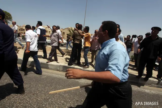 Anti-Mubarak protesters clash with riot police after a court sentenced deposed president Hosni Mubarak to life in prison, outside the police academy where the court is located in Cairo June 2, 2012. Mubarak was sentenced...
