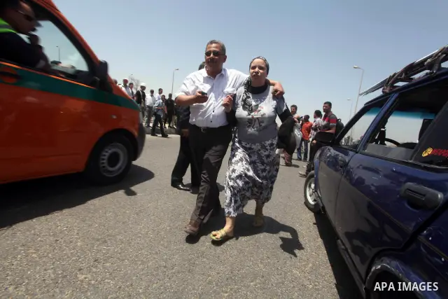 Relatives of people who died during Egypt's revolution react after a court sentenced deposed president Hosni Mubarak to life in prison, outside the police academy where the court is located in Cairo June 2, 2012. Mubarak...