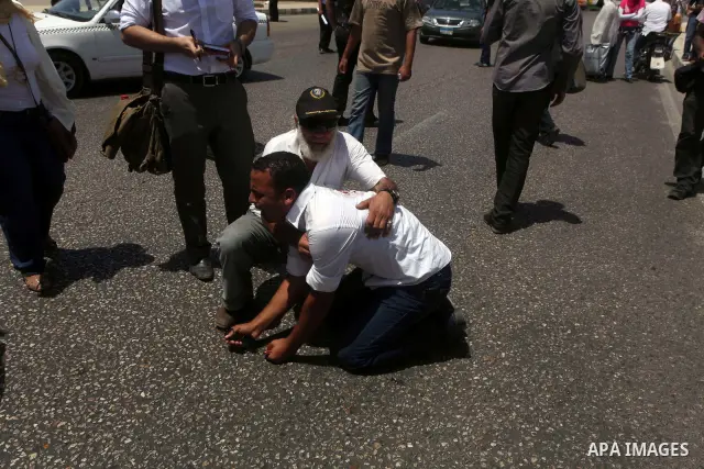 Supporters of deposed president Hosni Mubarak react after a court sentenced him to life in prison, outside the police academy where the court is located in Cairo June 2, 2012. Mubarak was sentenced to life in prison on S...
