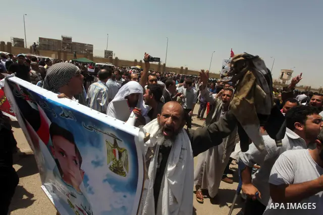 Relatives of people who died during Egypt's revolution react after a court sentenced deposed president Hosni Mubarak to life in prison, outside the police academy where the court is located in Cairo June 2, 2012. Mubarak...