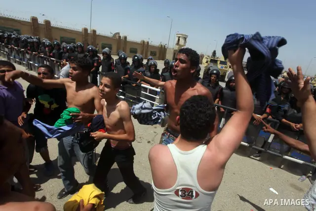 Anti-Mubarak protesters clash with riot police after a court sentenced deposed president Hosni Mubarak to life in prison, outside the police academy where the court is located in Cairo June 2, 2012. Mubarak was sentenced...
