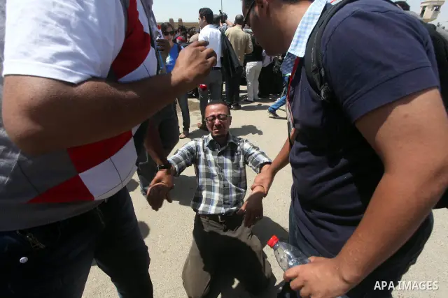 Relatives of people who died during Egypt's revolution react after a court sentenced deposed president Hosni Mubarak to life in prison, outside the police academy where the court is located in Cairo June 2, 2012. Mubarak...