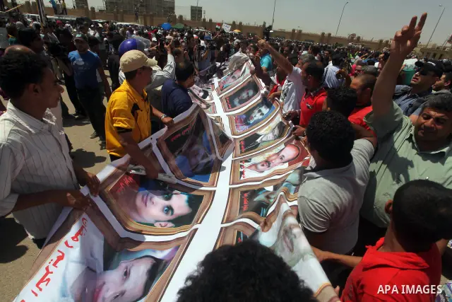 Relatives of people who died during Egypt's revolution react after a court sentenced deposed president Hosni Mubarak to life in prison, outside the police academy where the court is located in Cairo June 2, 2012. Mubarak...