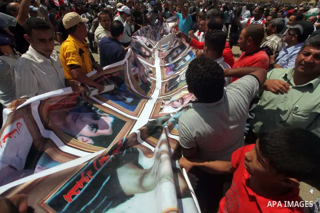 Relatives of people who died during Egypt's revolution react after a court sentenced deposed president Hosni Mubarak to life in prison, outside the police academy where the court is located in Cairo June 2, 2012. Mubarak...