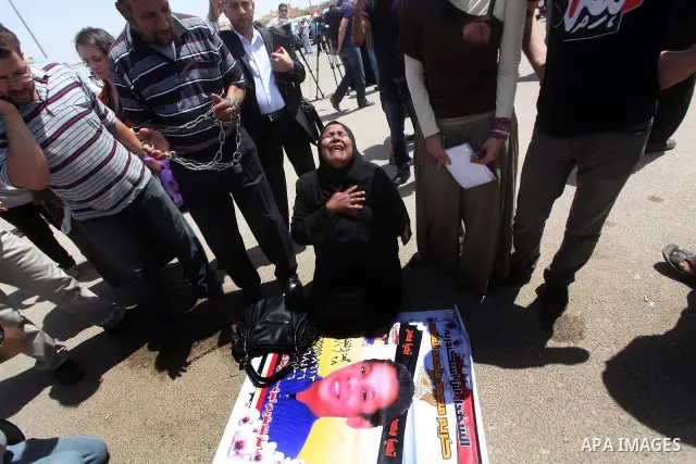 Relatives of people who died during Egypt's revolution react after a court sentenced deposed president Hosni Mubarak to life in prison, outside the police academy where the court is located in Cairo June 2, 2012. Mubarak...