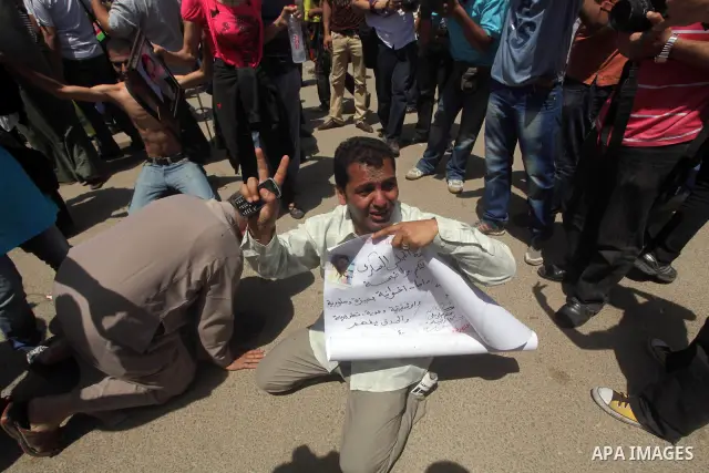 Relatives of people who died during Egypt's revolution react after a court sentenced deposed president Hosni Mubarak to life in prison, outside the police academy where the court is located in Cairo June 2, 2012. Mubarak...