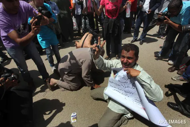 Relatives of people who died during Egypt's revolution react after a court sentenced deposed president Hosni Mubarak to life in prison, outside the police academy where the court is located in Cairo June 2, 2012. Mubarak...