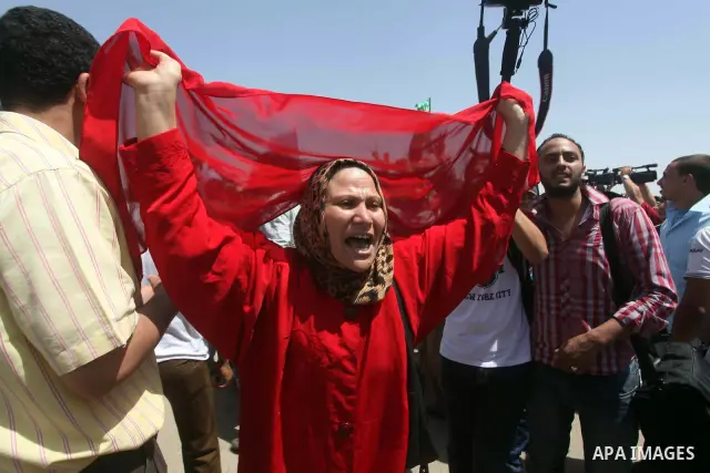 Relatives of people who died during Egypt's revolution react after a court sentenced deposed president Hosni Mubarak to life in prison, outside the police academy where the court is located in Cairo June 2, 2012. Mubarak...