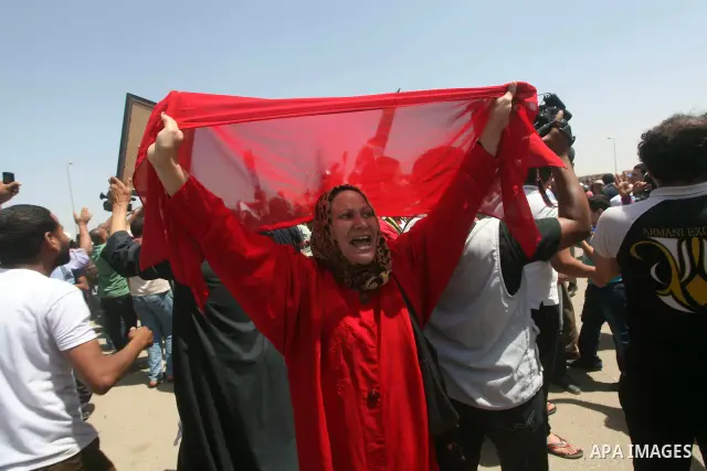 Relatives of people who died during Egypt's revolution react after a court sentenced deposed president Hosni Mubarak to life in prison, outside the police academy where the court is located in Cairo June 2, 2012. Mubarak...