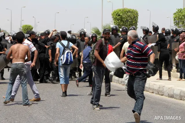 Anti-Mubarak protesters clash with riot police after a court sentenced deposed president Hosni Mubarak to life in prison, outside the police academy where the court is located in Cairo June 2, 2012. Mubarak was sentenced...