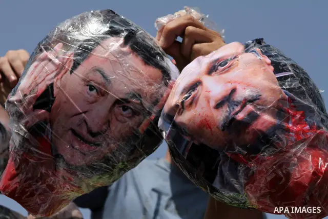 Relatives of people who died during Egypt's revolution react after a court sentenced deposed president Hosni Mubarak to life in prison, outside the police academy where the court is located in Cairo June 2, 2012. Mubarak...