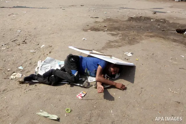 Egyptians sleep during a sit-in at Tahrir Square, after a court sentenced deposed president Hosni Mubarak to life in prison, in Cairo June 4, 2012. Thousands of Egyptians have taken to the streets in protest at the verdi...