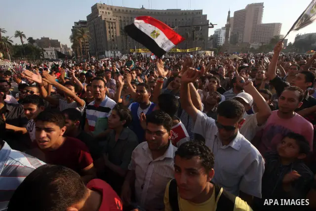 Protesters wave Egypt's flags during a demonstration at Tahrir square in Cairo, against the verdict for deposed leader Hosni Mubarak June 4, 2012. Egyptian pro-democracy campaigners called on Sunday for a new uprising, s...