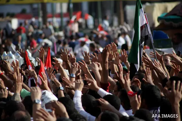 Protesters wave Egypt's flags during a demonstration at Tahrir square in Cairo, against the verdict for deposed leader Hosni Mubarak June 4, 2012. Egyptian pro-democracy campaigners called on Sunday for a new uprising, s...
