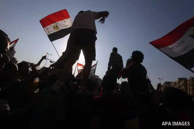 Protesters wave Egypt's flags during a demonstration at Tahrir square in Cairo, against the verdict for deposed leader Hosni Mubarak June 4, 2012. Egyptian pro-democracy campaigners called on Sunday for a new uprising, s...