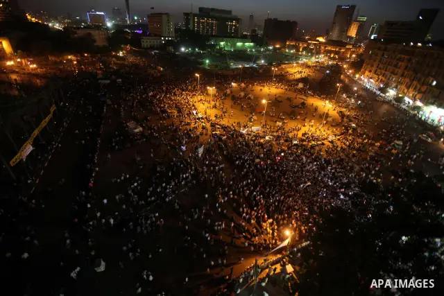 Protesters wave Egypt's flags during a demonstration at Tahrir square in Cairo, against the verdict for deposed leader Hosni Mubarak June 4, 2012. Egyptian pro-democracy campaigners called on Sunday for a new uprising, s...