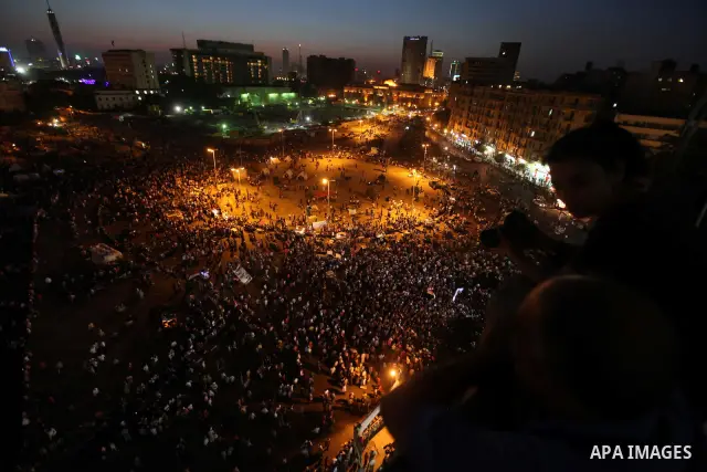 Protesters wave Egypt's flags during a demonstration at Tahrir square in Cairo, against the verdict for deposed leader Hosni Mubarak June 4, 2012. Egyptian pro-democracy campaigners called on Sunday for a new uprising, s...