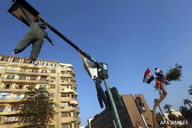 Protesters wave Egypt's flags during a demonstration at Tahrir square in Cairo, against the verdict for deposed leader Hosni Mubarak June 4, 2012. Egyptian pro-democracy campaigners called on Sunday for a new uprising, s...